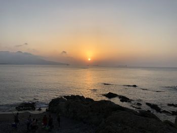 Scenic view of sea against sky during sunset