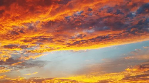 Low angle view of dramatic sky during sunset