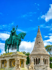 Low angle view of statue against building