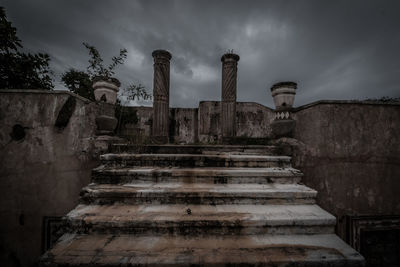 Low angle view of old ruin against sky