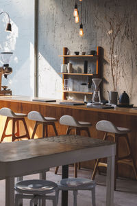 Empty chairs and tables in restaurant