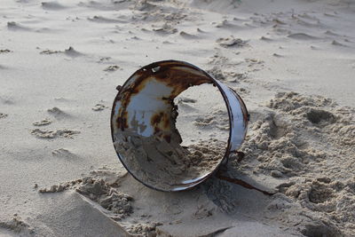 Close-up of abandoned sand on beach