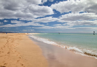 The beautiful water edge on the sandy beach of risco del paso bay on the east coast of fuerteventura