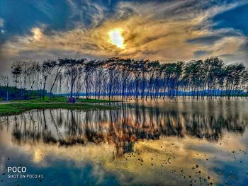 Scenic view of lake against sky during sunset