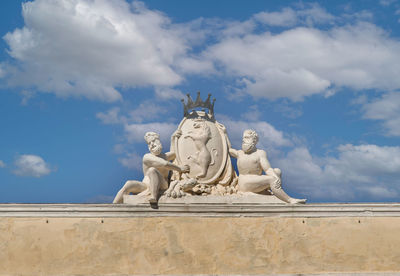 Top of agostino spinola palace with marble statues against clear blue sky, genoa, liguria, italy