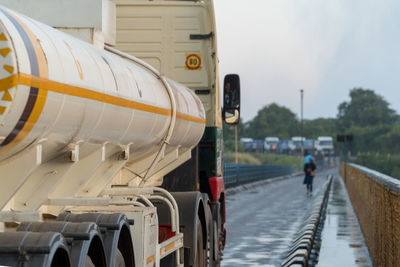 Rear view of truck on bridge against sky