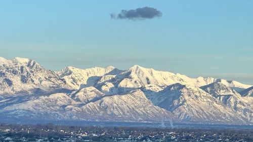 Scenic view of snowcapped mountains against sky  and the utah lake