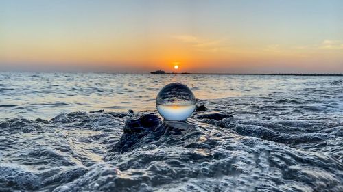 Scenic view of sea against sky during sunset