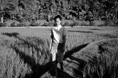 Woman standing on field