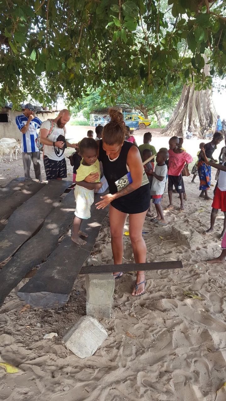 PEOPLE STANDING ON GROUND