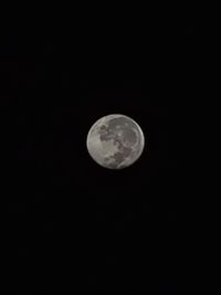 Low angle view of moon against sky at night