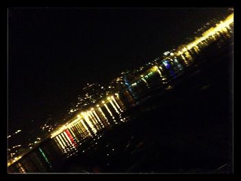 Illuminated bridge at night