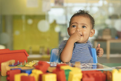 Close-up of cute girl playing with toys