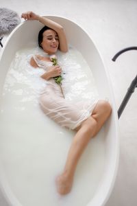 High angle view of woman in bathtub