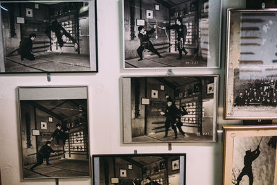 People walking in city seen through glass window