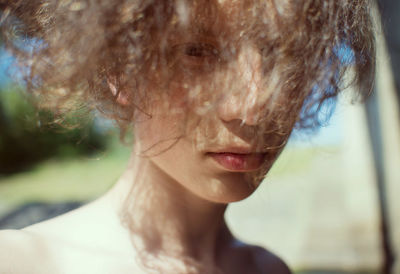 Close-up of young woman with hair on face