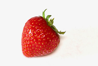 Close-up of strawberries against white background