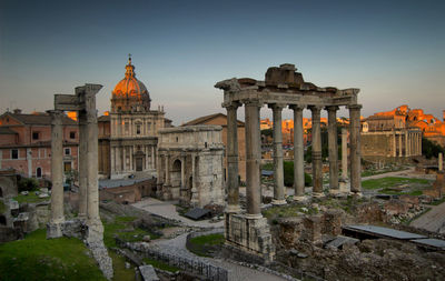 Temple of saturn and imperial forum at sunset
