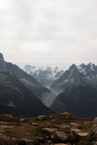 Scenic view of mountains against cloudy sky