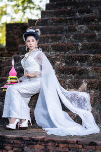 Portrait of woman standing in traditional clothing