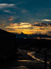 Scenic view of silhouette mountains against sky during sunset