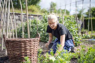 Young woman working in garden