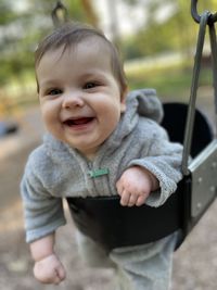 Portrait of cute girl sitting on slide