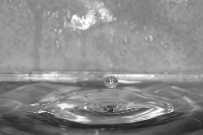 Close-up of drop splashing in water