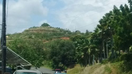 Scenic view of landscape against cloudy sky