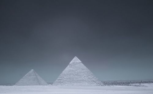 Giza pyramids at desert against clear sky