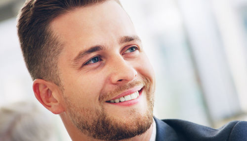 Close-up of young man looking away