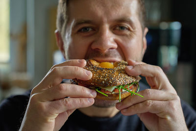 Cropped hand of woman holding food
