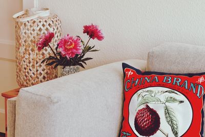 Close-up of flowers on sofa at home