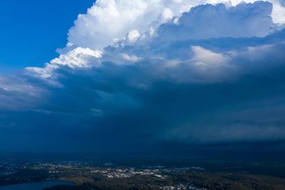 Aerial view of city and buildings against sky