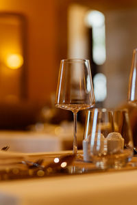 Close-up of wineglasses on table