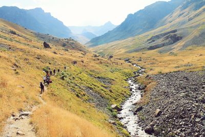 High angle view of people hiking on mountain