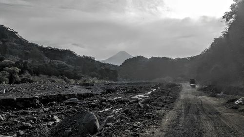 Scenic view of landscape against cloudy sky