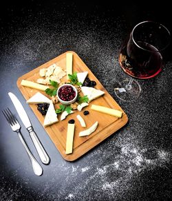 High angle view of various fruits on cutting board