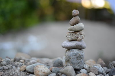 Close-up of stone stack on shore