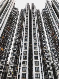 Low angle view of modern buildings in city against sky