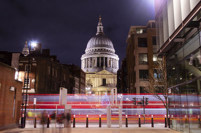 Illuminated buildings in city at night