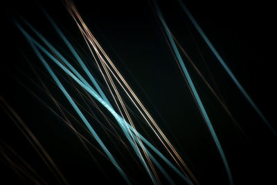 Light trails against black background