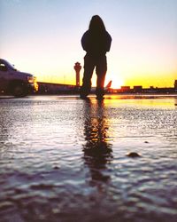 Silhouette of people in water