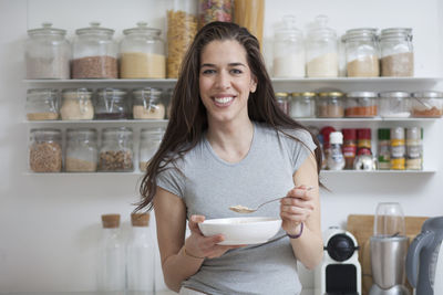 Close-up of woman having food at table