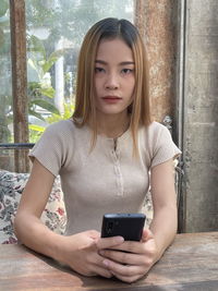 Young woman using mobile phone