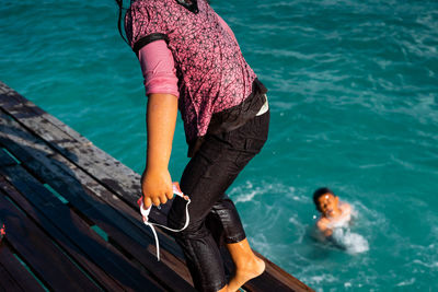 High angle view of man surfing in sea