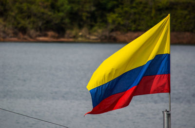 Close-up of flag against water