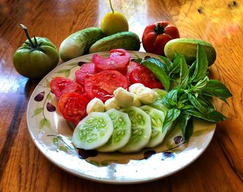 High angle view of fruits in plate on table