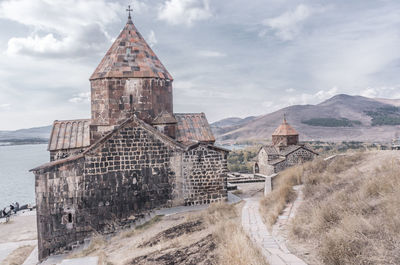 Panoramic shot of ancient church against sky in armenia