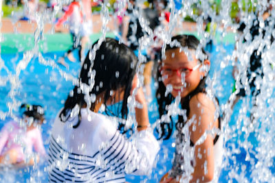 Portrait of smiling girl in swimming pool